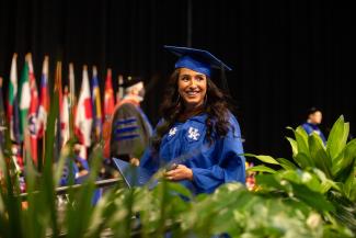 Student walking across the stage