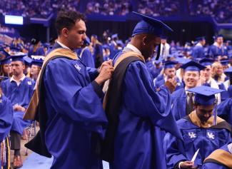 Student being hooded by another student