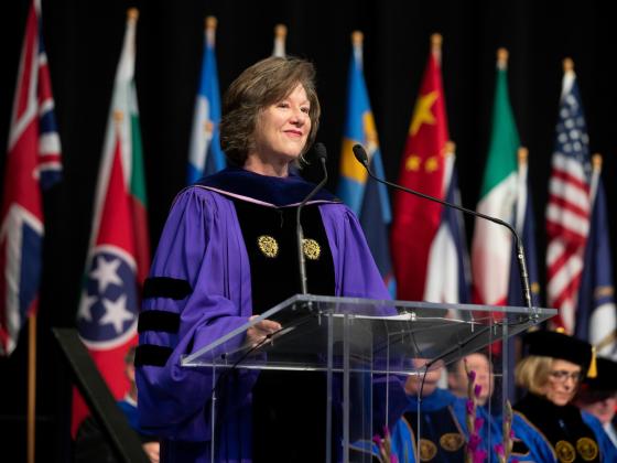 Dr. Beth Barnes on stage at commencement