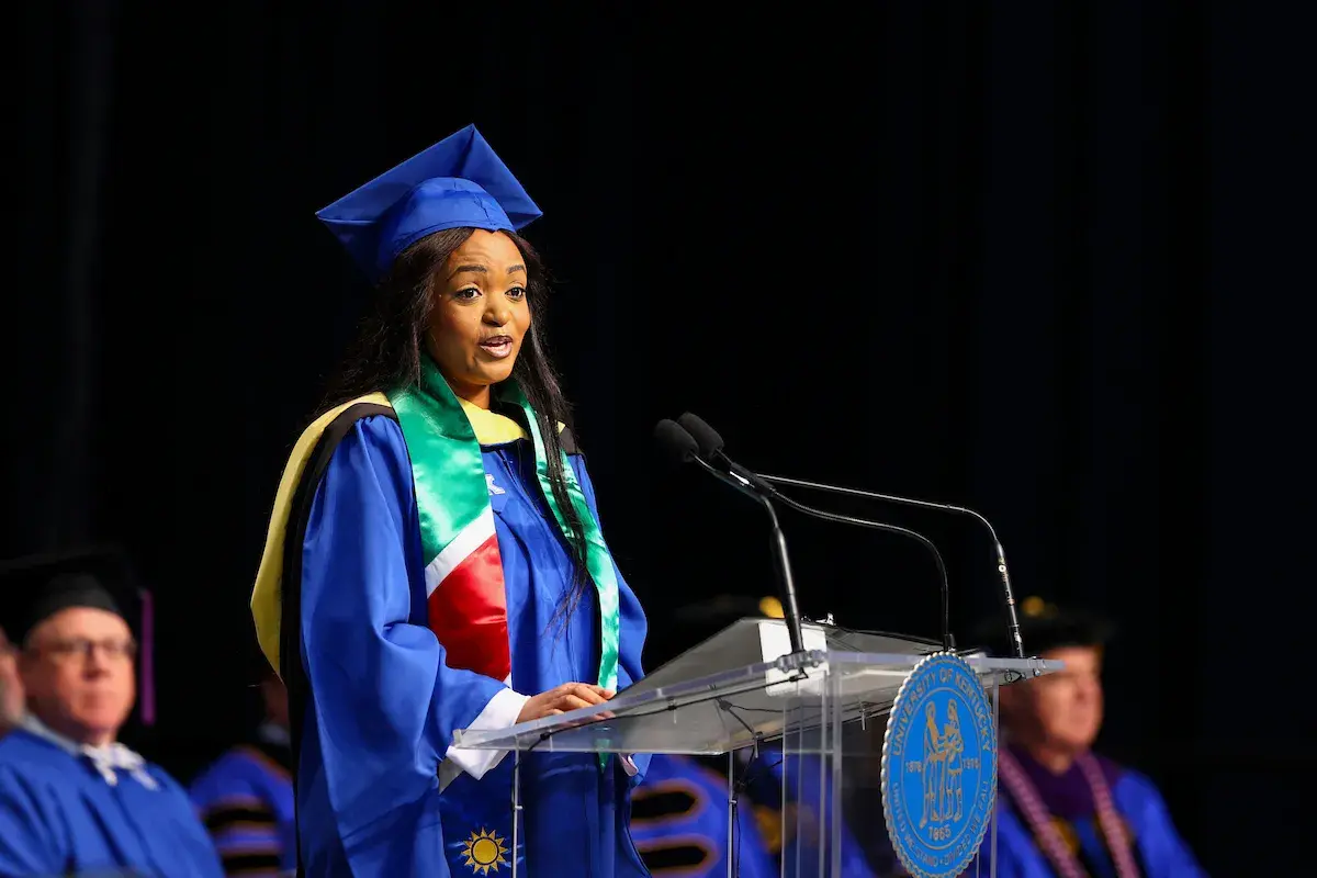 Esther Ndashaala speaking at graduation